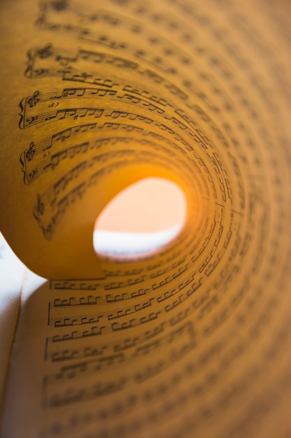 Free photo macro detail of rolled up musical note paper