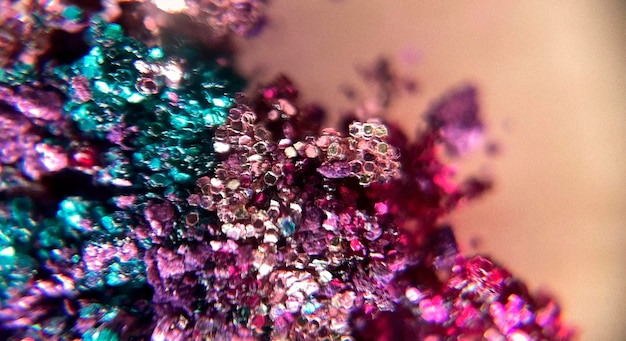 Free photo macro photography of a background with brightly colored glitter