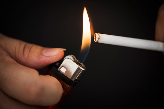 Macro shot of hand holding lighter