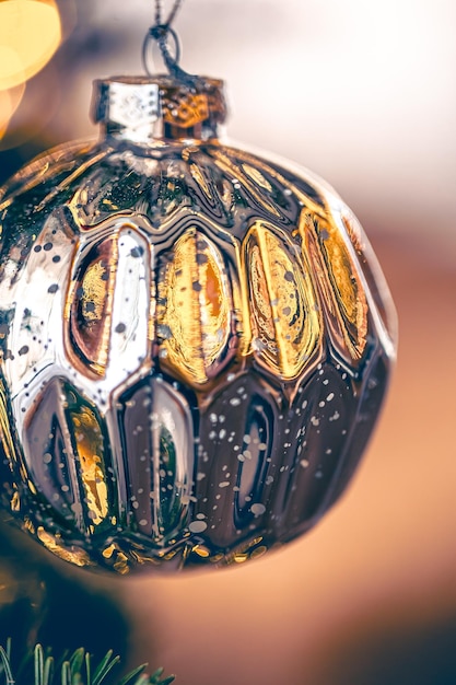 Macro shot of a silver christmas ball on a blurred background