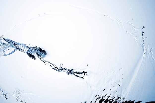 Macro shot of transparent liquid on white background