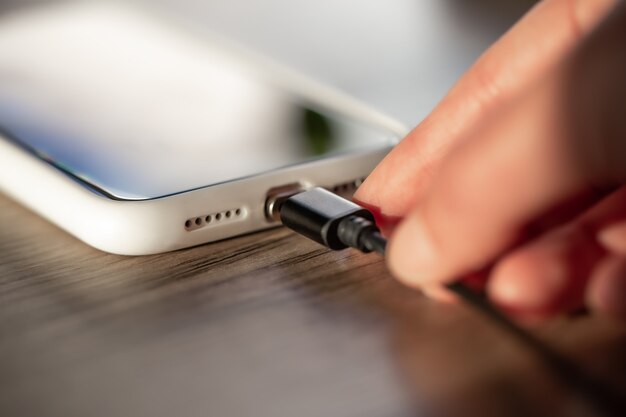 Magnetic cable for charging smartphone, close up.