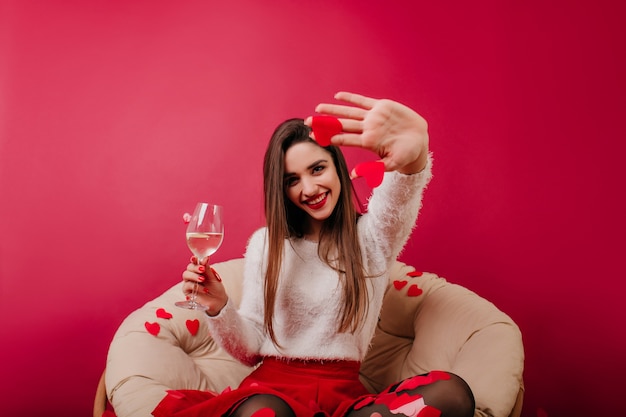 Magnificent lady with long dark hair enjoying valentine's day celebration