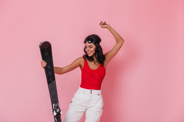 Magnificent woman dancing with skis