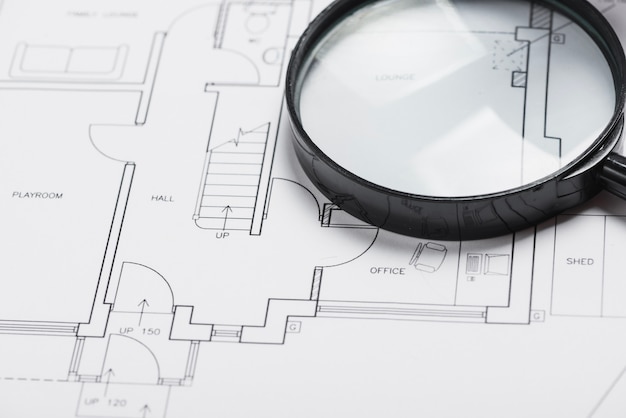 Magnifying glass on blueprint