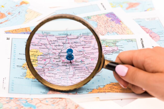 Magnifying glass on a map - close-up