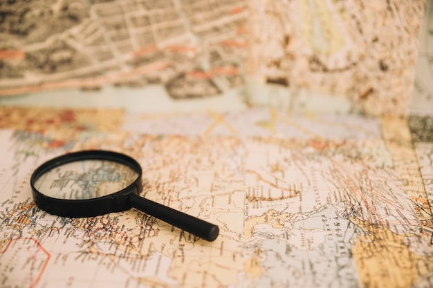 Free photo magnifying glass on old map