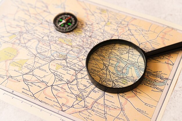 Magnifying glass on an old travel map