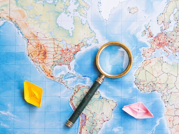 Magnifying glass on world map