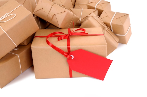 Mail packages with red gift tag