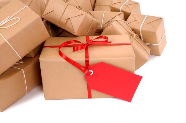 Mail packages with red gift tag