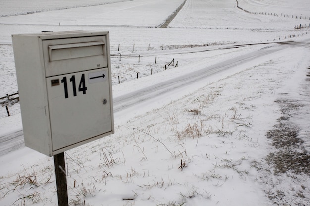 Mailbox on an empty snowy field