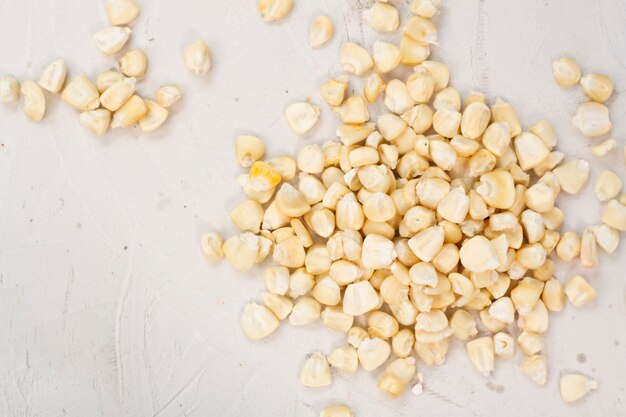 Maize seeds on plain background