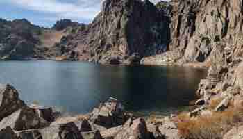 Foto gratuita il maestoso picco di una montagna si riflette nell'acqua tranquilla generata dall'intelligenza artificiale