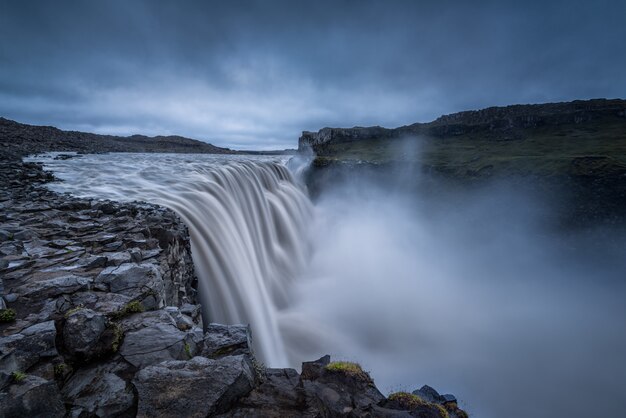 Majestic waterfalls on rocky environment