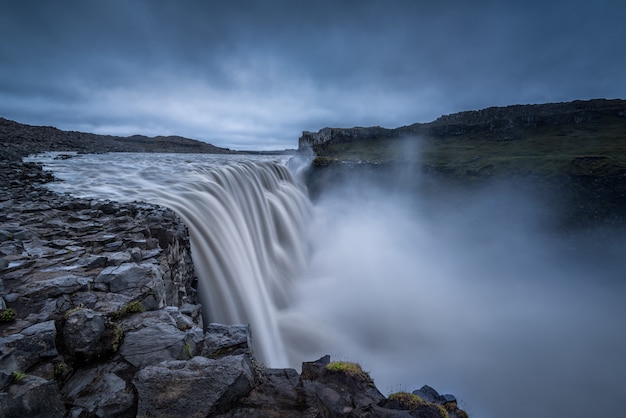 Majestic waterfalls on rocky environment