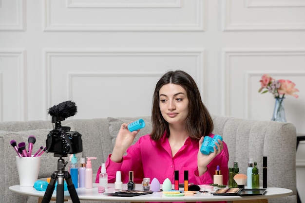 Free photo make up blogger cute lovely beautiful young lady recording video on camera with blue curls