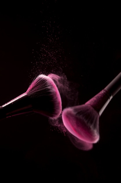 Makeup brushes with pink powder traces