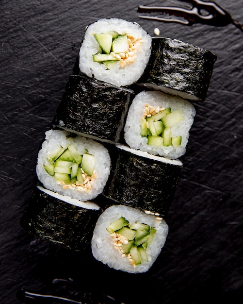 maki roll with cucumber and sesame seeds