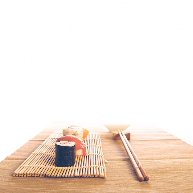 Free photo maki sushi set on wooden background