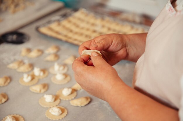 Making caucasian khinkali with stuffing