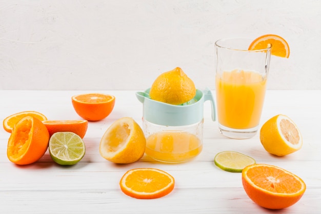 Making citrus juice with manual juicer
