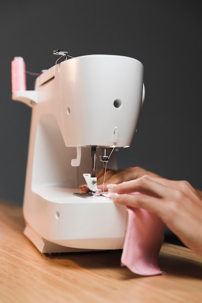 Free photo making a fabric mask with sewing machine