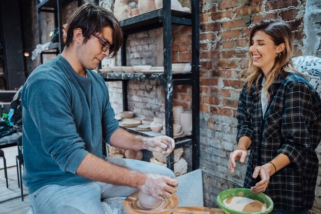 Making a handmade clay pot. Pottery lesson, hobby.