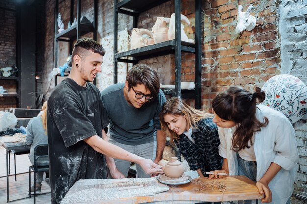 Making a handmade clay pot. Pottery lesson with master.