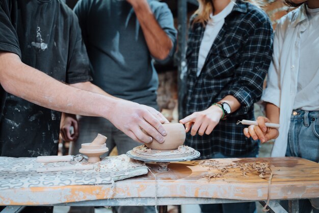 Making a handmade clay pot. Pottery lesson with master.