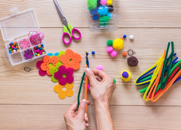 Making handmade craft on wooden table