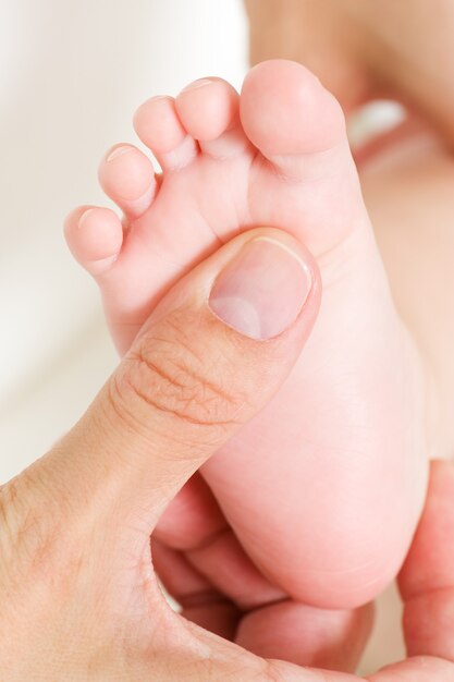 making massage of child's foot