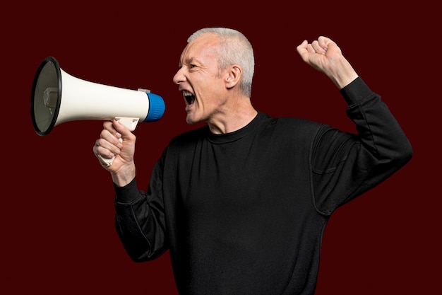 Free photo male activist with a megaphone with design space