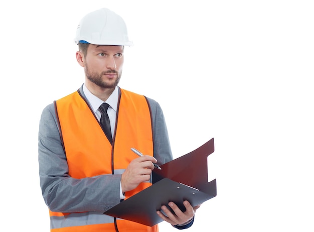 Free photo male architect in a safety west and a hardhat writing on his cli