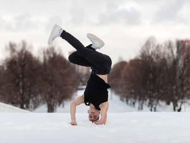 Male artist dancing hip hop outside