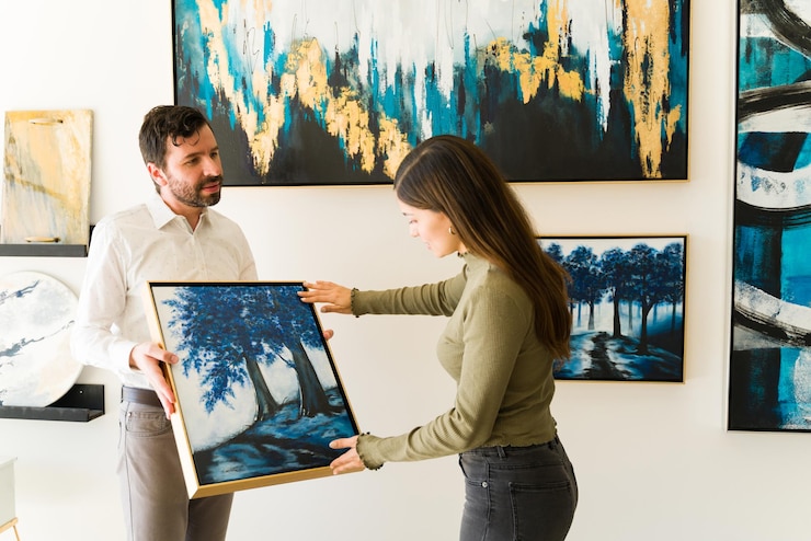 male artist showing his painting female client interested buying some artwork from exihibiton art gallery 662251 355