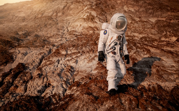Male astronaut exploring the surroundings during a space mission on another planet