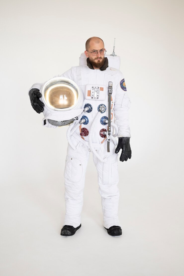 Free Photo male astronaut holding his helmet