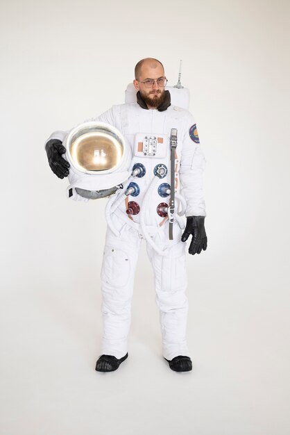 Male astronaut holding his helmet