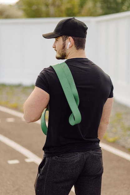 Male athlete doing fitness training. Workout outside the gym.