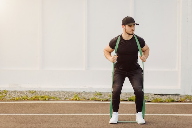 Male athlete doing fitness training. Workout outside the gym.