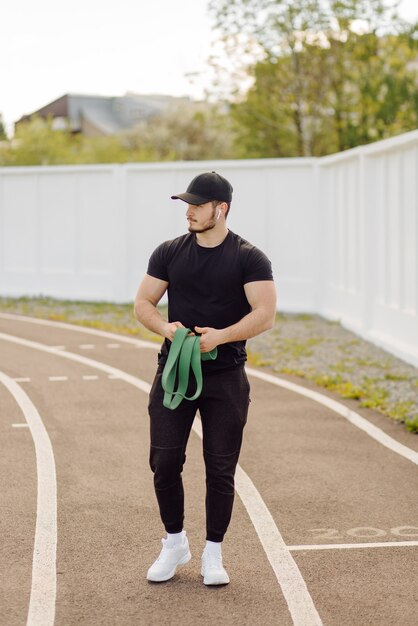 Male athlete doing fitness training. Workout outside the gym.