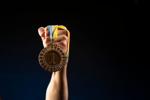 Male athlete holding a medal