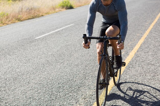 Male athlete riding cycle