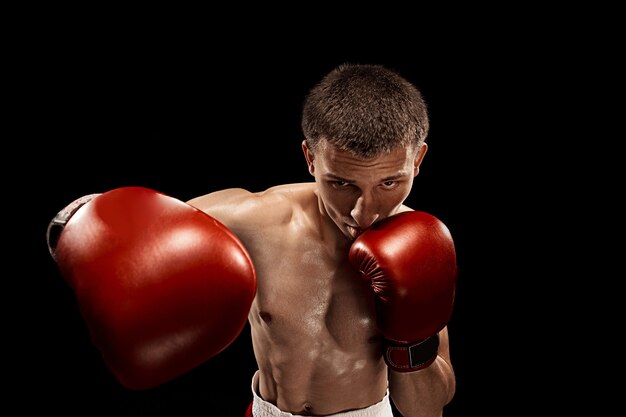 Male boxer boxing with dramatic edgy lighting