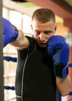 Free photo male boxer with gloves training