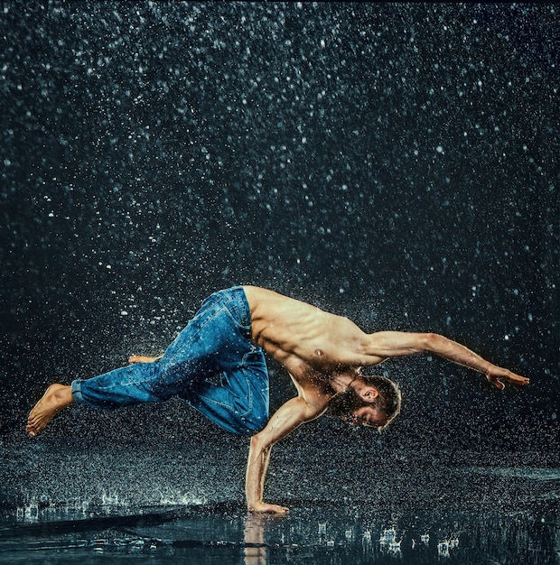 Free photo the male break dancer in water.