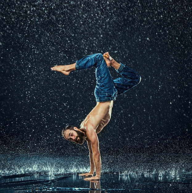 Free photo the male break dancer in water.