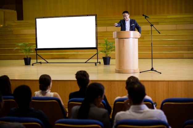 Male business executive giving a speech