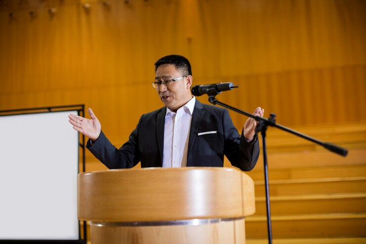 Free Photo male business executive giving a speech